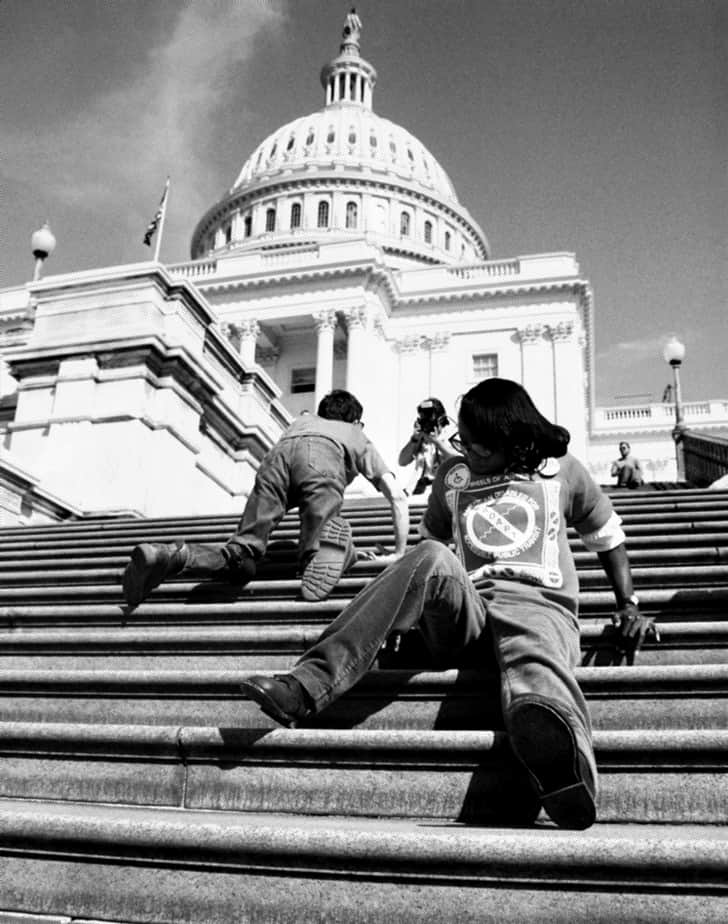 Demonstrators crawl steps to capitol building